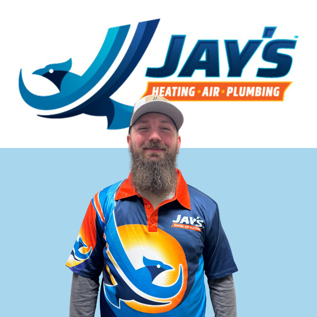 A man with a beard wearing a Jay's Heating, Air, Plumbing logo shirt stands in front of a backdrop featuring the same company logo.