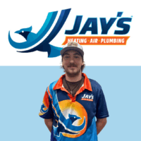 A 5-Star Technician wearing a Jay's Heating, Air, and Plumbing uniform stands in front of the company logo.