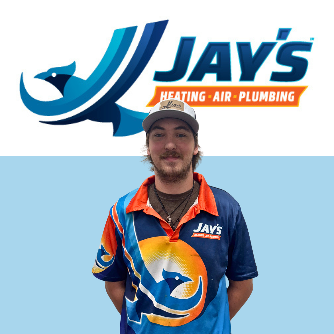 A man in a branded Jay's Heating, Air & Plumbing shirt and hat stands in front of the company’s logo on a blue and white background.