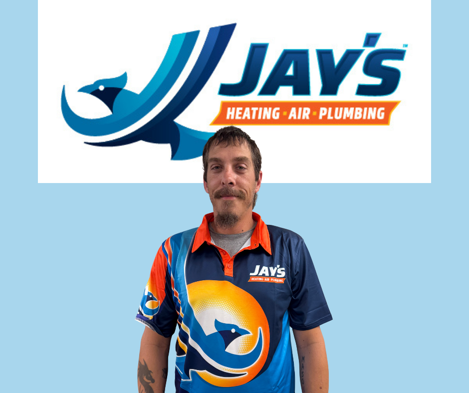 A man wearing a Jay’s Heating, Air, Plumbing shirt stands in front of a large company logo, representing the team’s 5-Star Technicians and commitment to exceptional service.