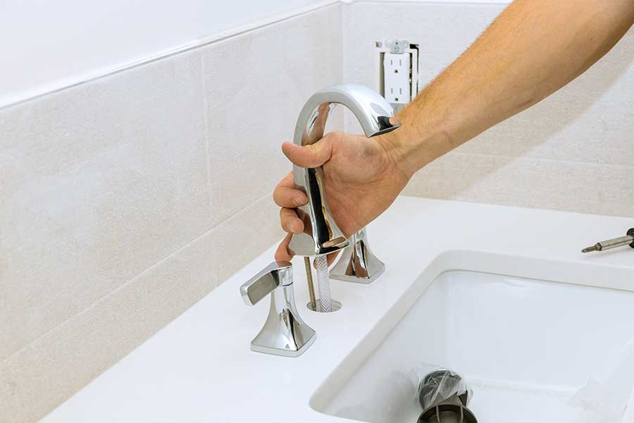 Jay's plumber performing faucet installation in Mount Airy home