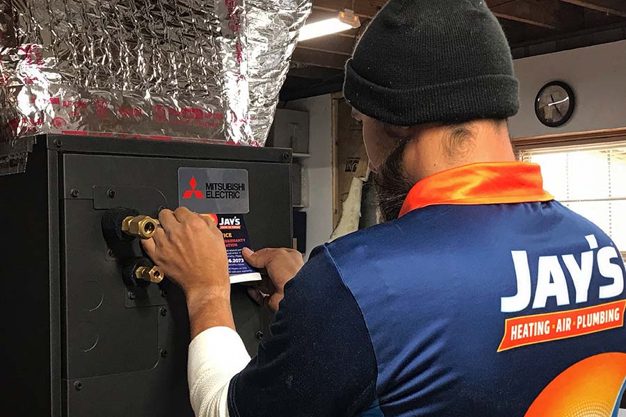 Jay’s technician performing heat pump replacement in Mount Airy