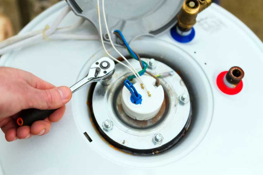 Plumber handling water heater repair during routine service in Mount Airy NC